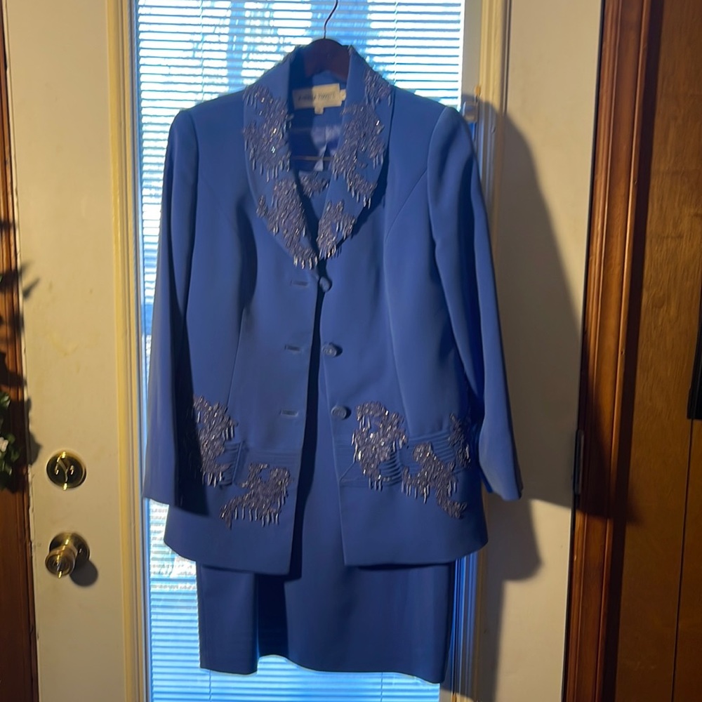 Two piece suit outfit. Size 12 with designs around collar and in front